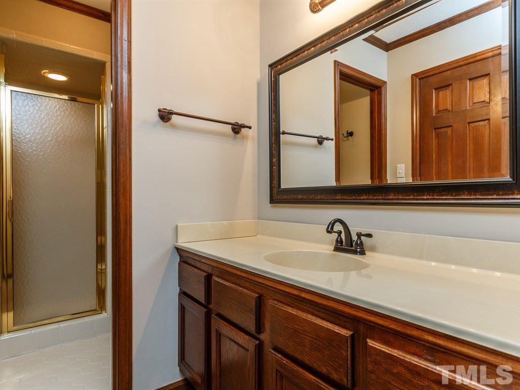 8501 Council Court Raleigh, NC 27615 - Photo 13 of 19 a bathroom with a sink and two mirror