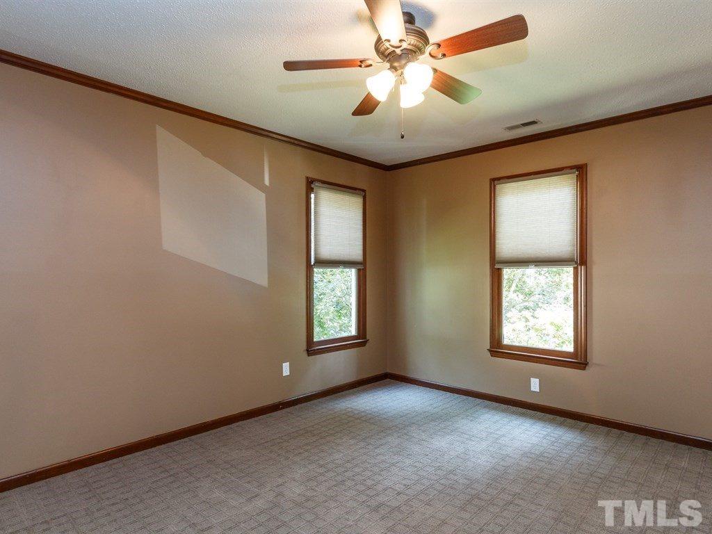 8501 Council Court Raleigh, NC 27615 - Photo 14 of 19 an empty room with windows and fan