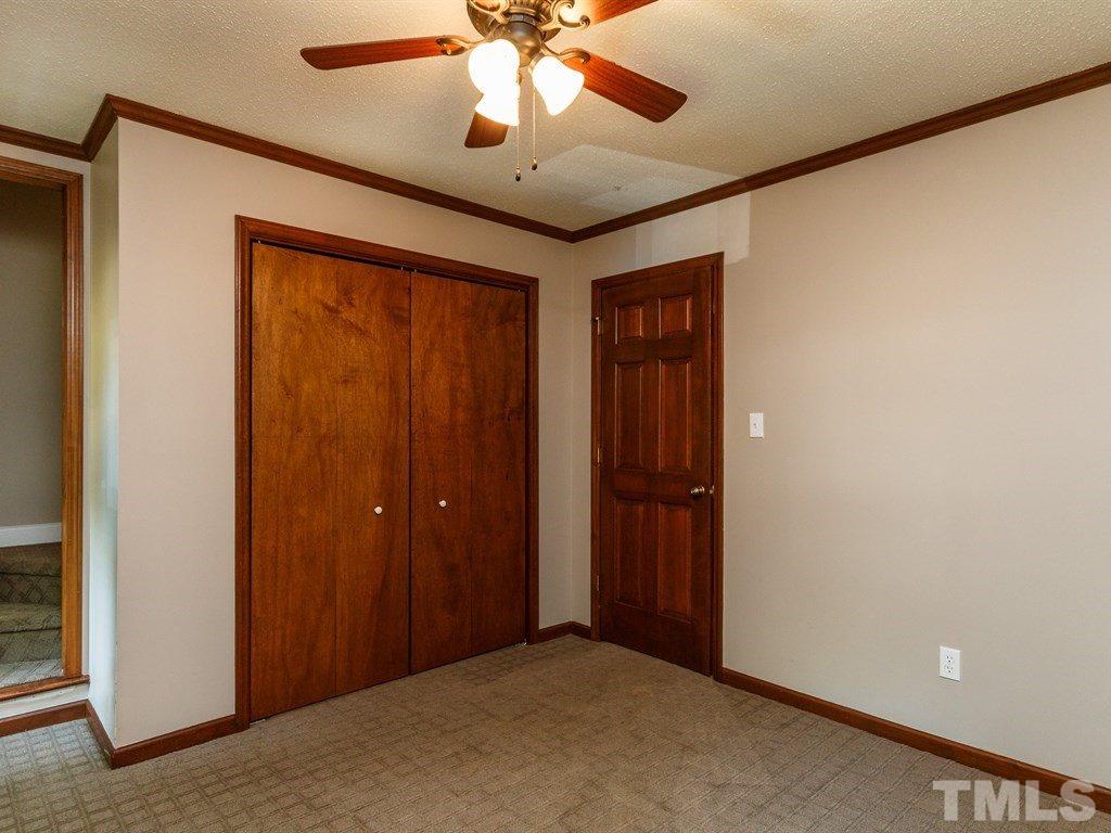 8501 Council Court Raleigh, NC 27615 - Photo 16 of 19 an empty room with chandelier fan