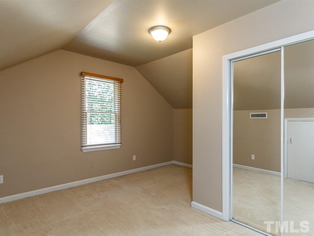 8501 Council Court Raleigh, NC 27615 - Photo 18 of 19 an empty room with windows and entrance
