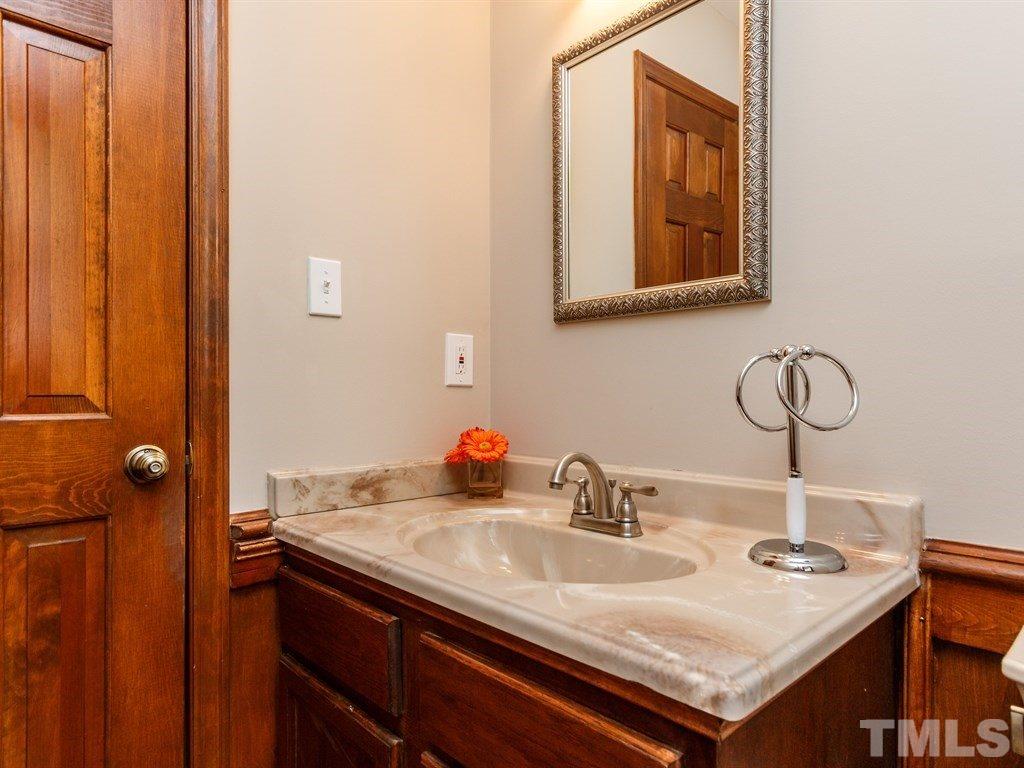 8501 Council Court Raleigh, NC 27615 - Photo 8 of 19 a bathroom with a sink and a mirror