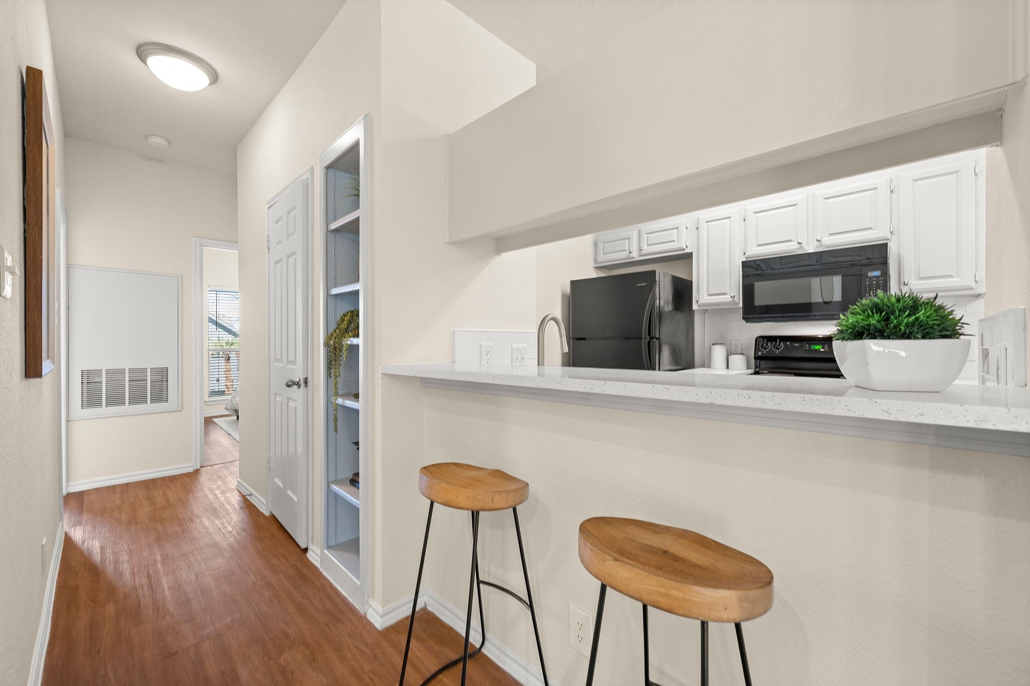 914 West 26th Street, Unit 202 Austin, TX 78705 - Photo 16 of 34 a kitchen with furniture and a potted plant
