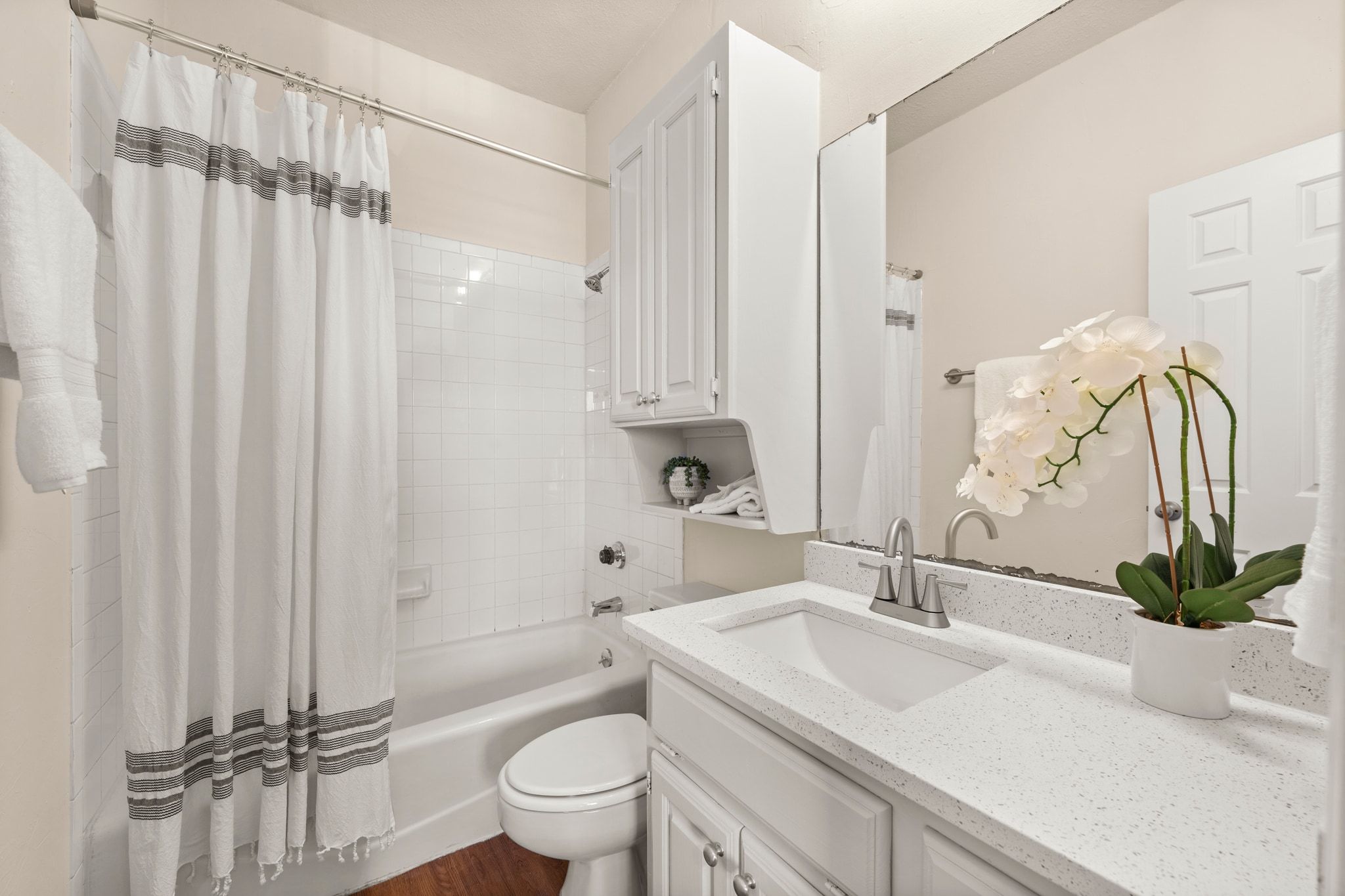 914 West 26th Street, Unit 202 Austin, TX 78705 - Photo 23 of 34 a bathroom with a sink a toilet and a mirror