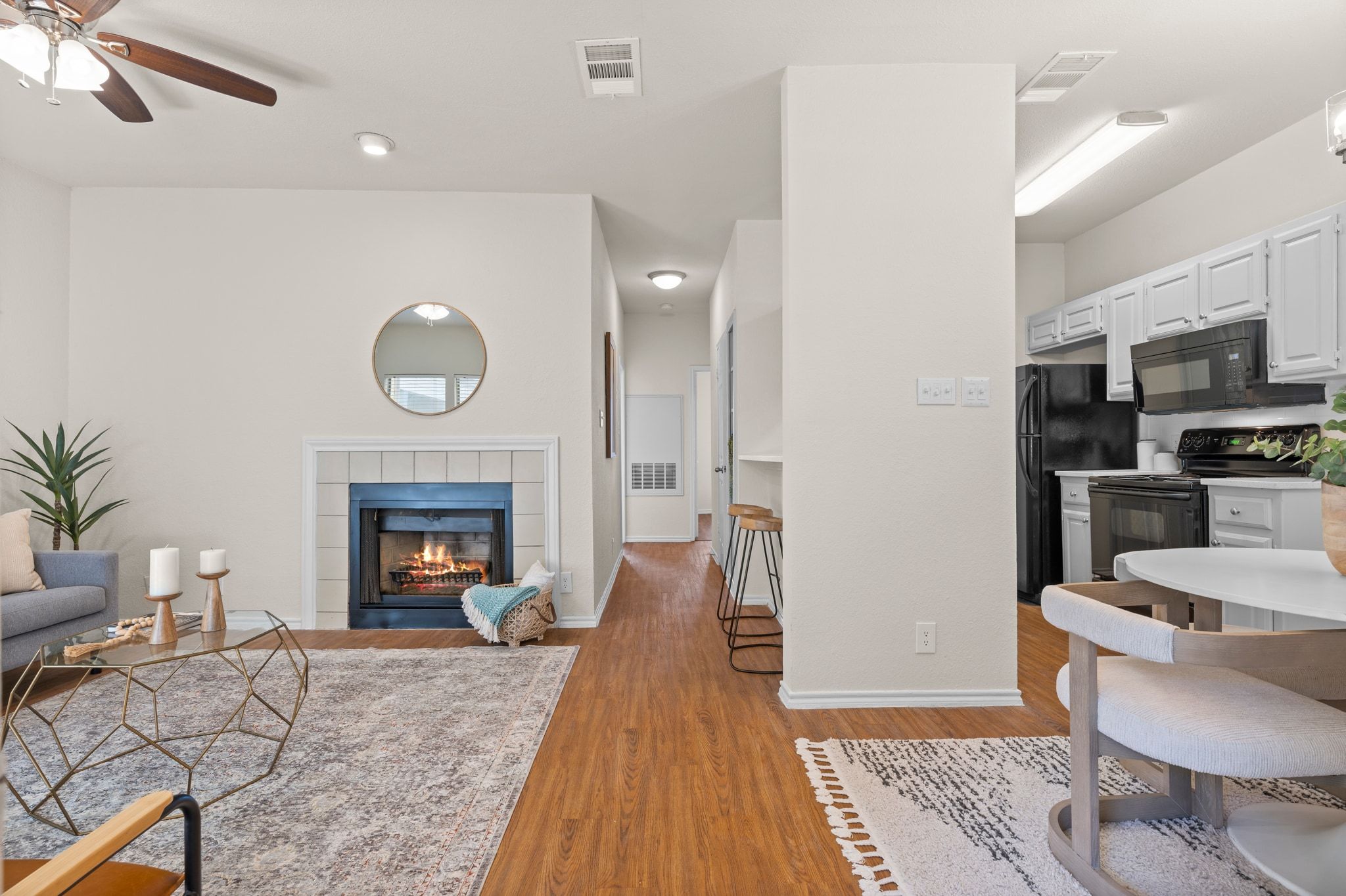 914 West 26th Street, Unit 202 Austin, TX 78705 - Photo 4 of 34 a living room with furniture and a fireplace