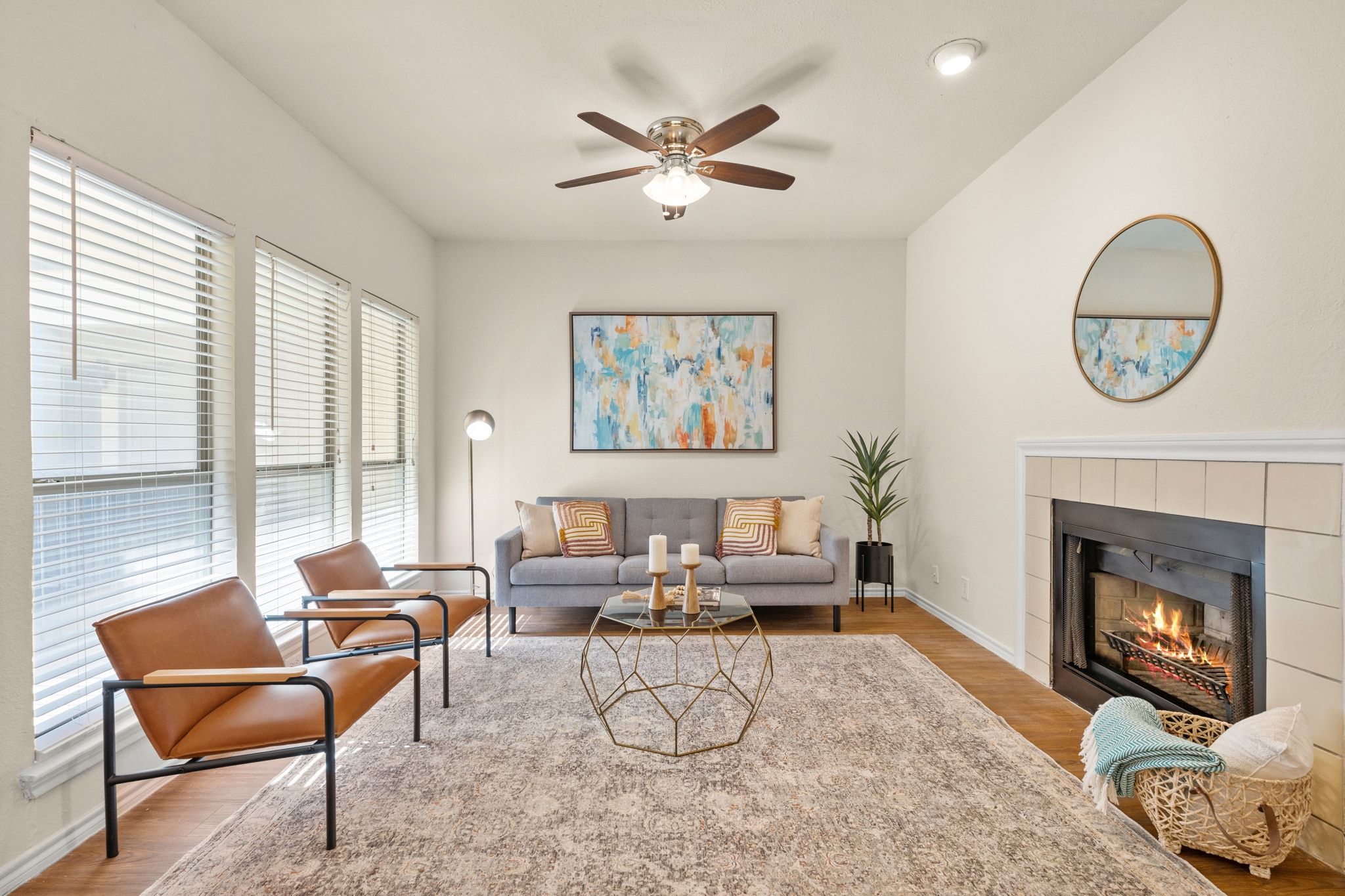 914 West 26th Street, Unit 202 Austin, TX 78705 - Photo 7 of 34 a living room with furniture a chandelier and a fireplace