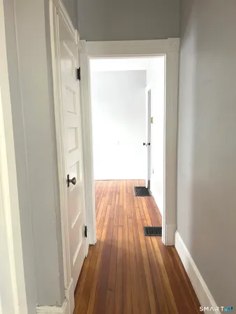 a view of bedroom with wooden floor
