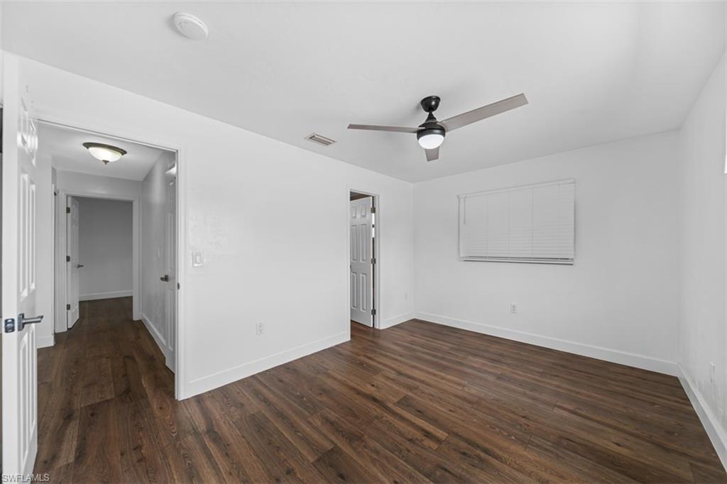 5460 Bayshore Road North Fort Myers, FL 33917 - Photo 12 of 14 a view of empty room with wooden floor and ceiling fan