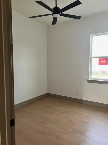 a view of an empty room with a window