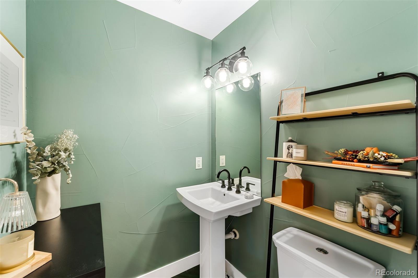 4270 Irving Street Denver, CO 80211 - Photo 14 of 34 a bathroom with a sink and a mirror