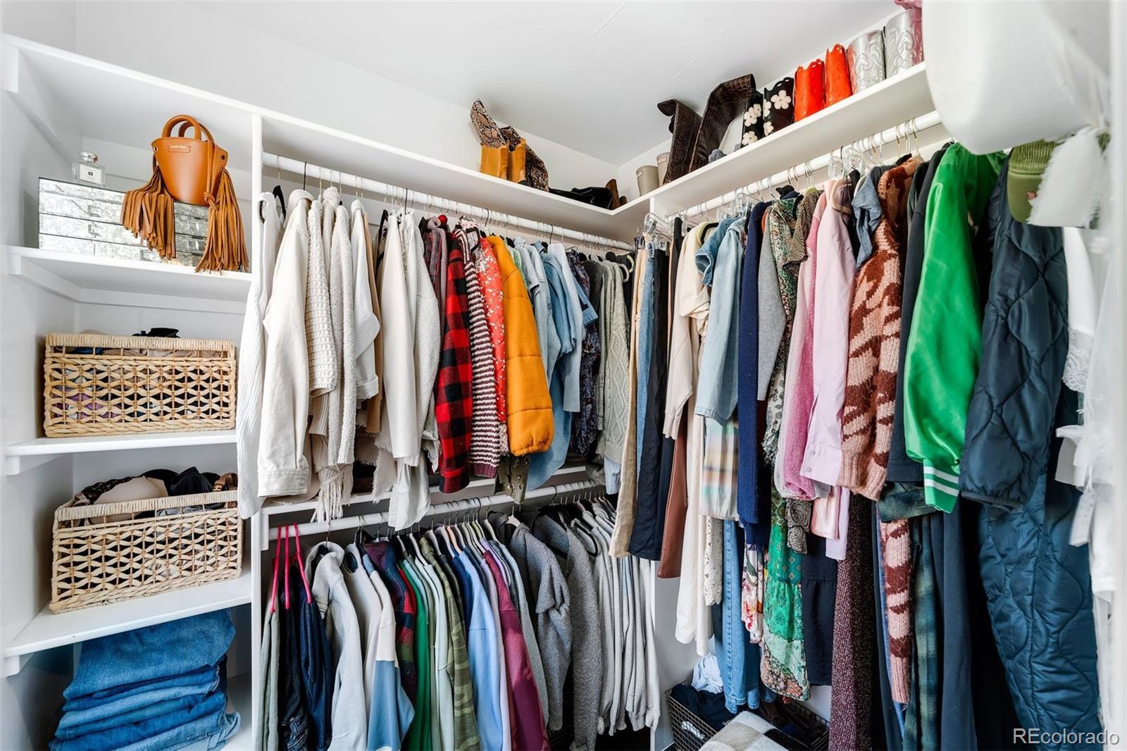 4270 Irving Street Denver, CO 80211 - Photo 19 of 34 a view of walk in closet with clothes and shoes