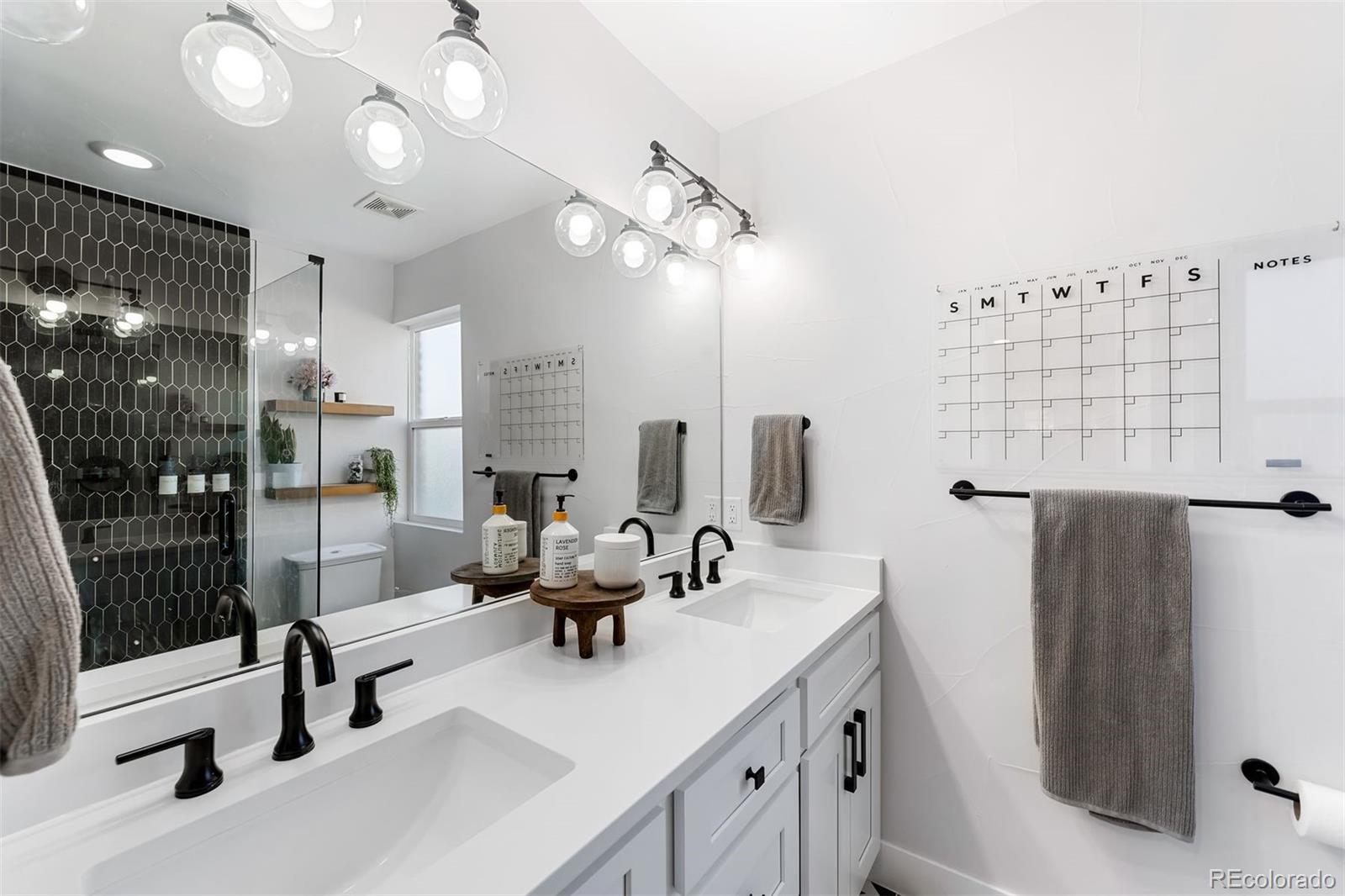 4270 Irving Street Denver, CO 80211 - Photo 20 of 34 a kitchen with a sink appliances and a counter top space