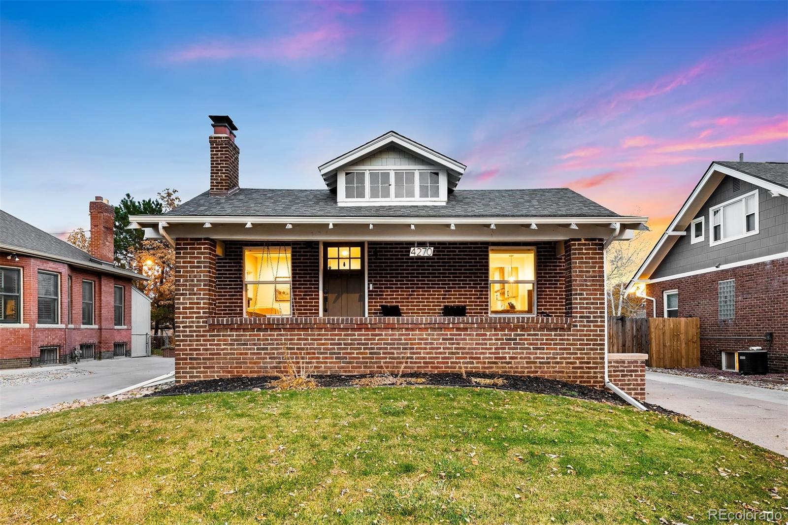 4270 Irving Street Denver, CO 80211 - Photo 2 of 34 a front view of a house with a yard