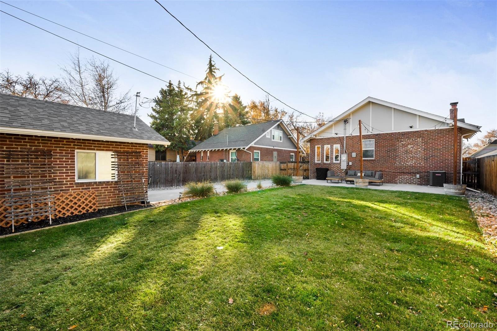 4270 Irving Street Denver, CO 80211 - Photo 32 of 34 a front view of a house with a yard table and chairs