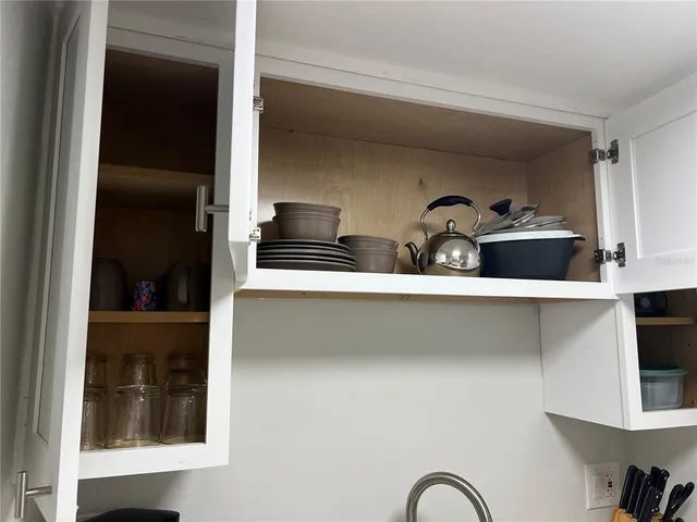 a close view of sink and cabinets