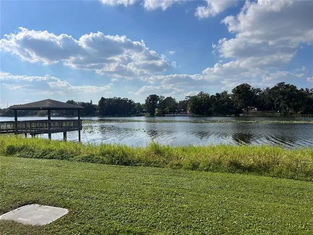 a view of a lake with houses in the back