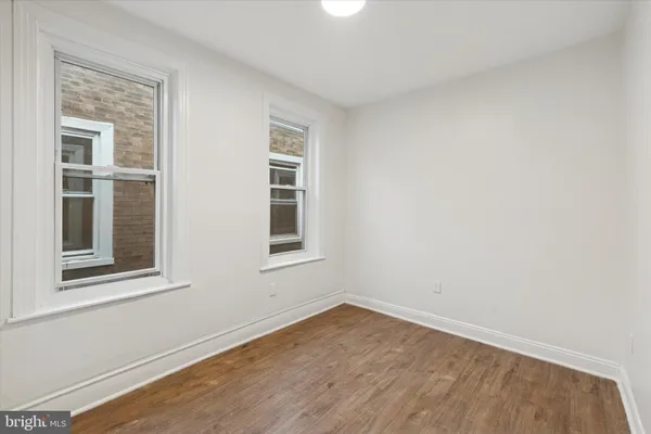 a view of empty room with windows