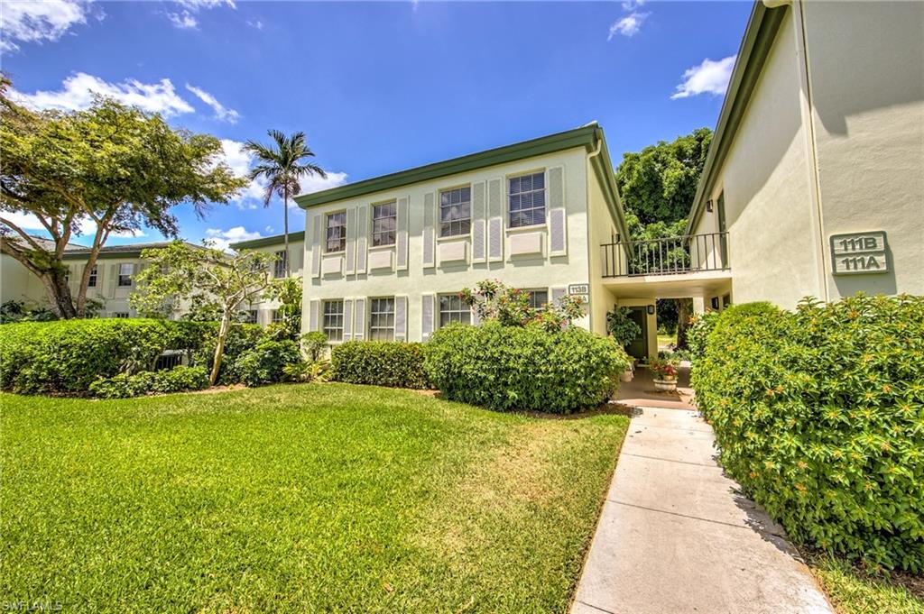 113 Bobolink Way, Unit 113B Naples, FL 34105 - Photo 1 of 15 a front view of a house with a yard