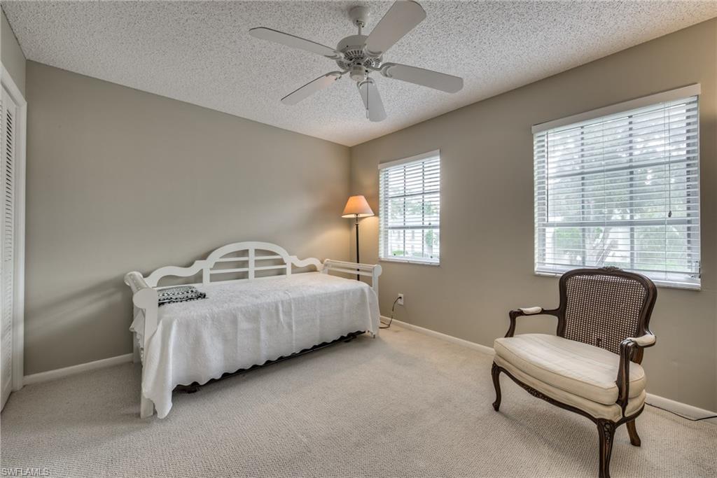 113 Bobolink Way, Unit 113B Naples, FL 34105 - Photo 11 of 15 a living room with furniture and a window
