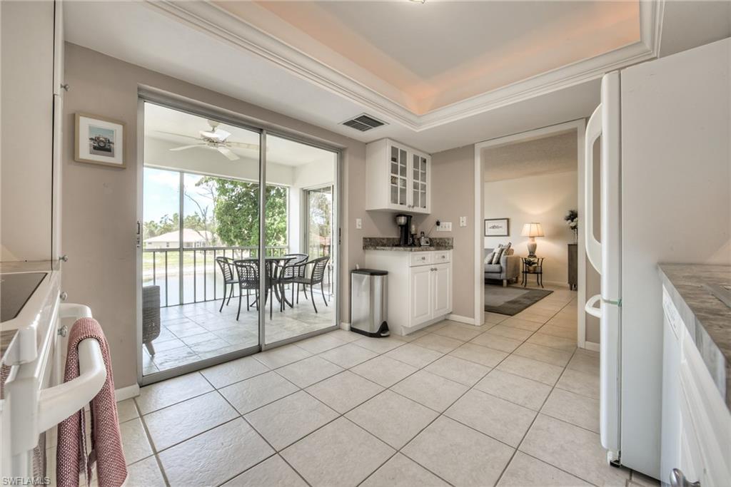113 Bobolink Way, Unit 113B Naples, FL 34105 - Photo 7 of 15 a kitchen with a sink and a large window