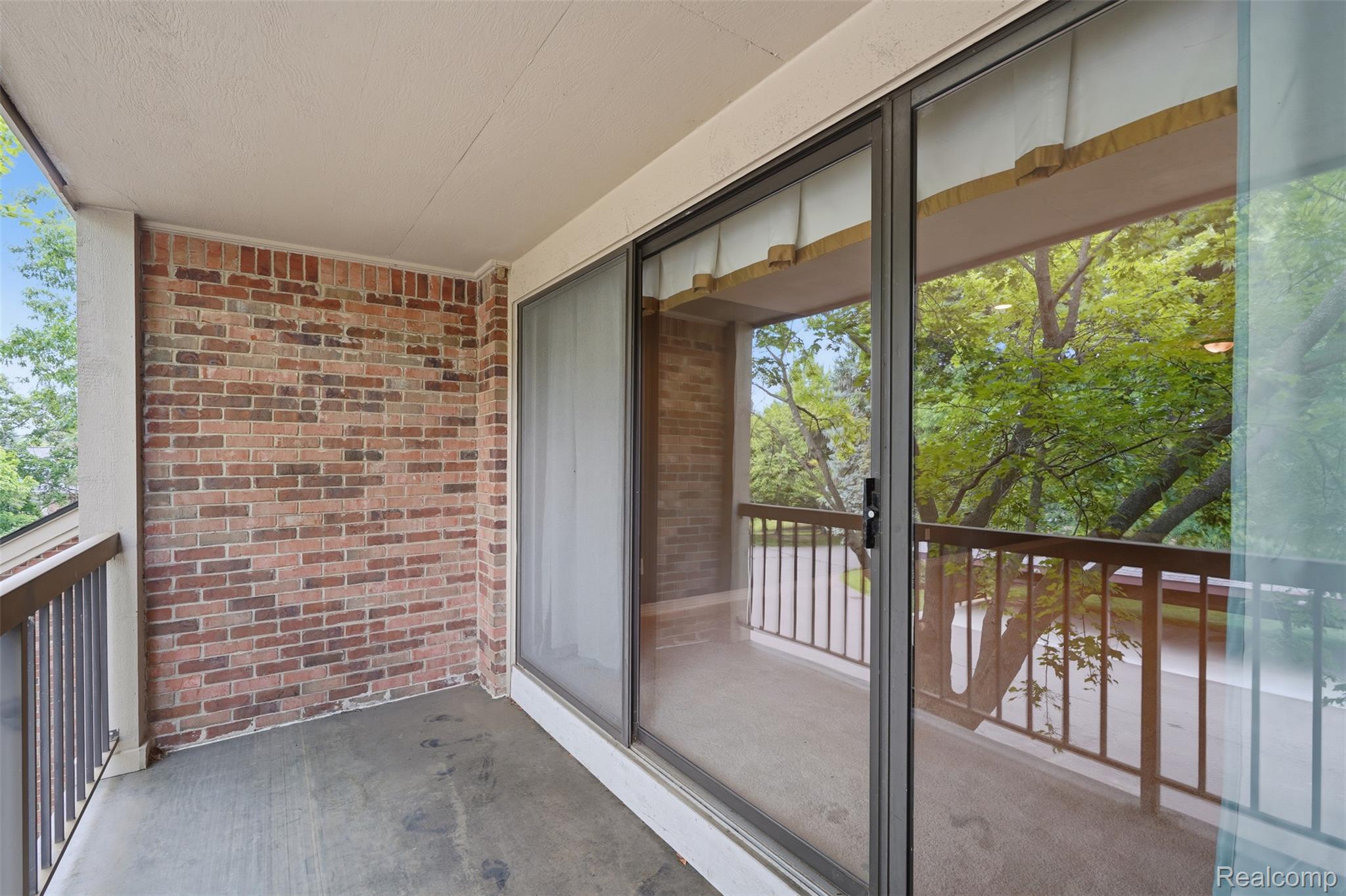 29726 Pine Ridge Circle Farmington, MI 48331 - Photo 22 of 40 Private balcony featuring brick siding