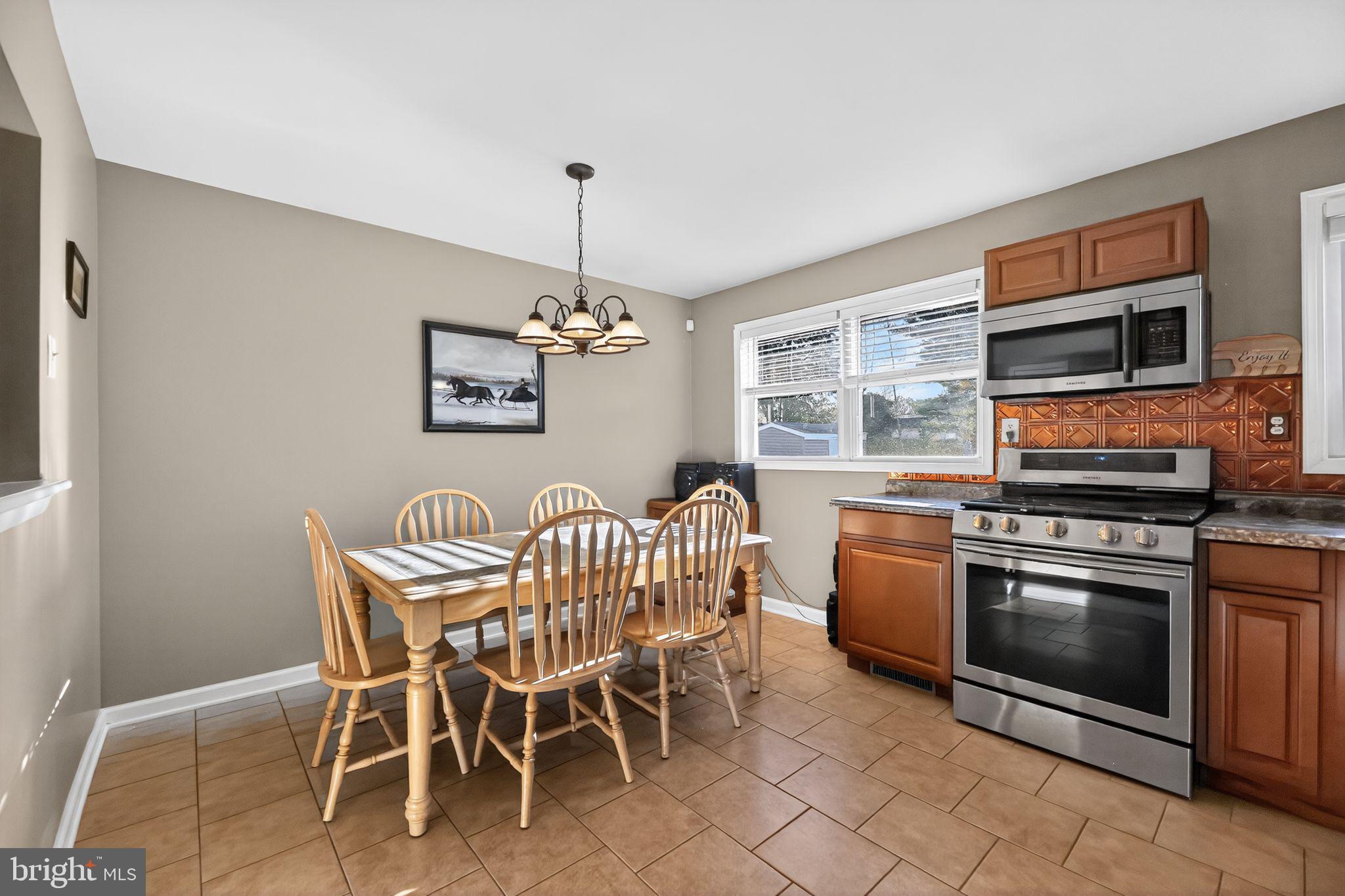 15 Winslow Road Sewell, NJ 08080 - Photo 6 of 18 a view of a dining room with furniture window and outside view