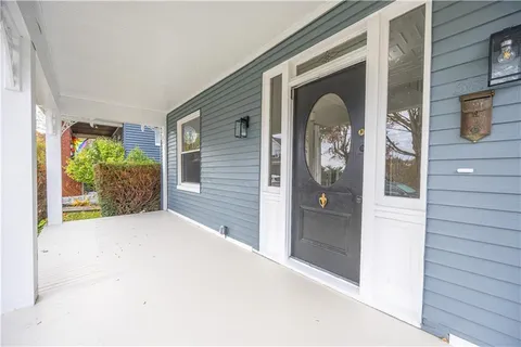 a front view of a house with a porch