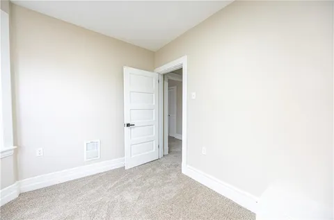 a view of an empty room and window