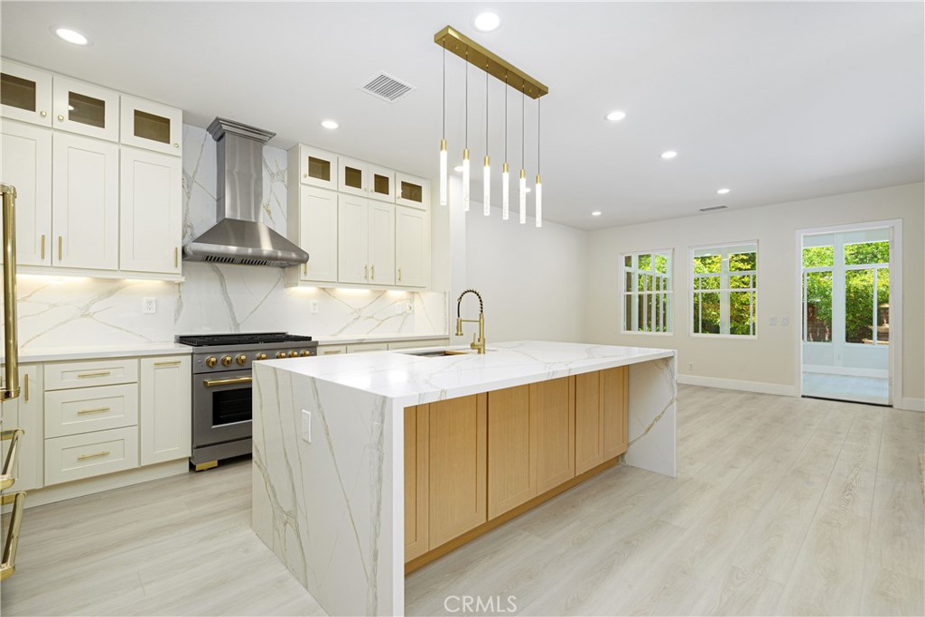 15 Plum Street Ladera Ranch, CA 92694 - Photo 21 of 113 a kitchen with a stove top oven sink and cabinets