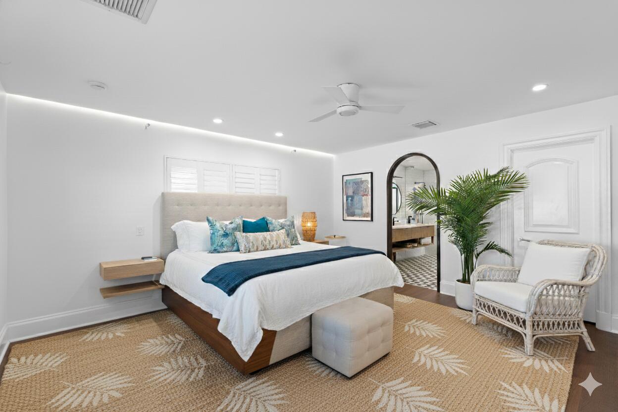 200 Ellamar Road West Palm Beach, FL 33405 - Photo 11 of 20 a bedroom with bed and a potted plant on table