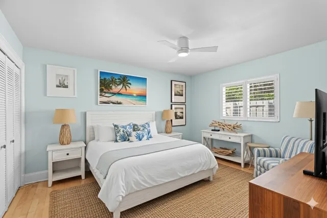 a bedroom with double bed and a desk