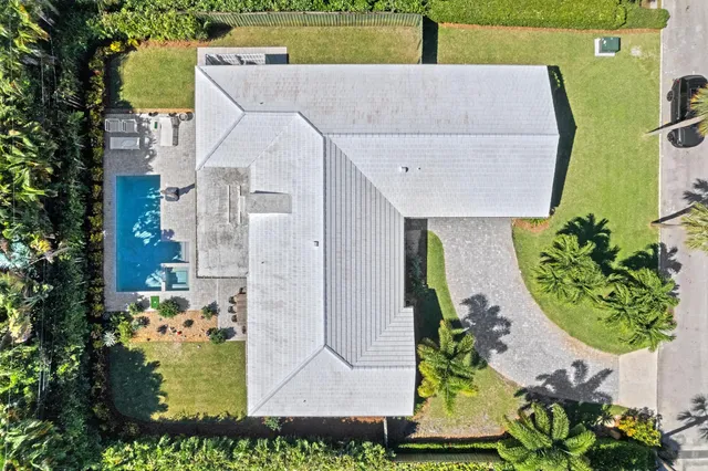 an aerial view of a house with a swimming pool