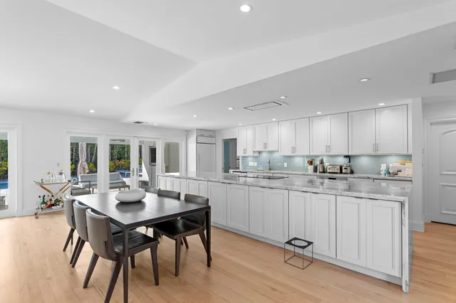 a kitchen with a table and chairs in it