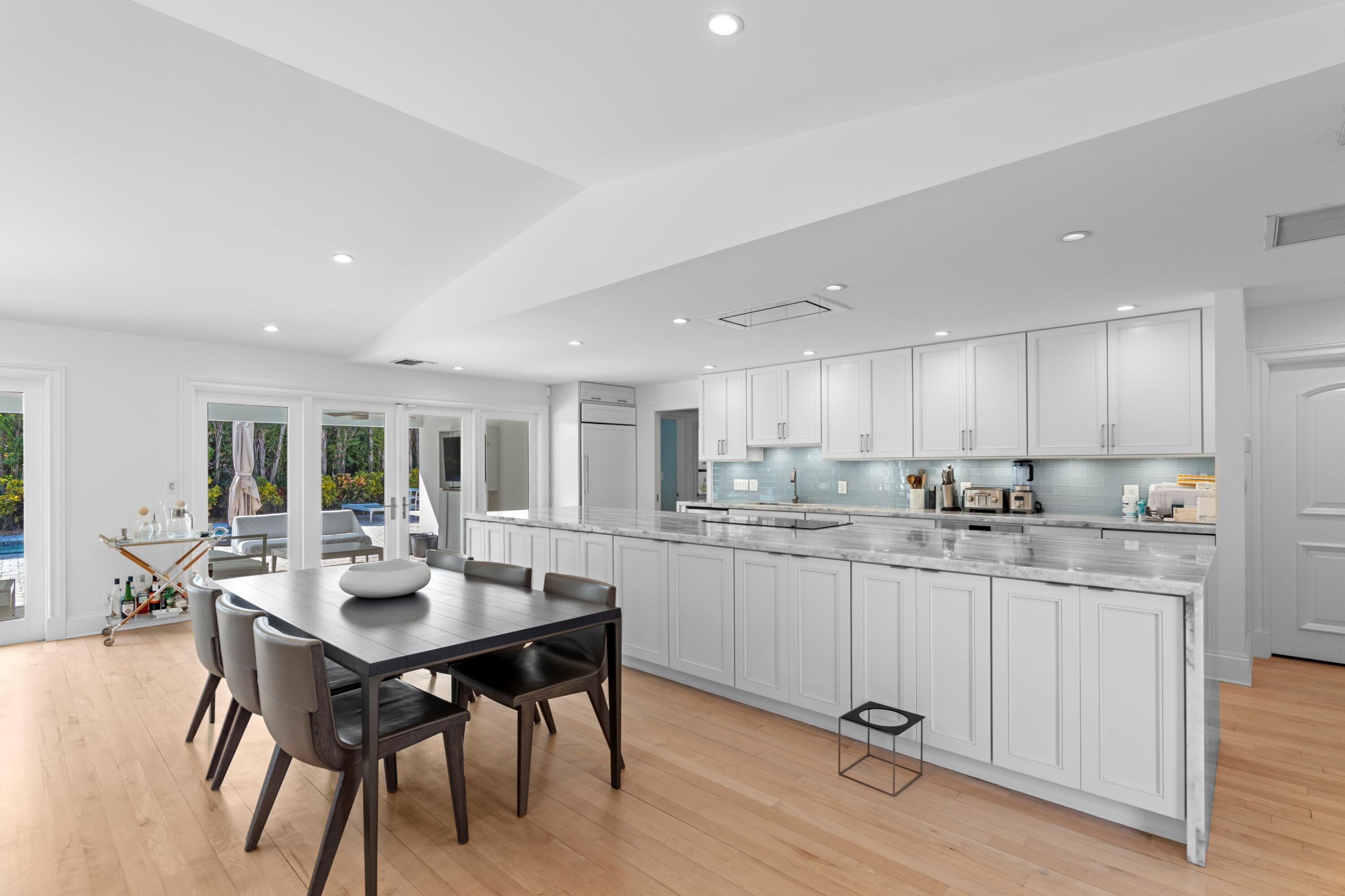 200 Ellamar Road West Palm Beach, FL 33405 - Photo 7 of 20 a kitchen with a table and chairs in it