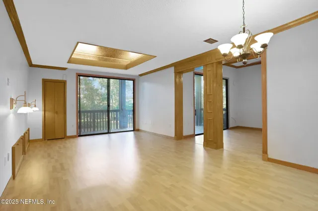 a view of a kitchen with a sink and a refrigerator