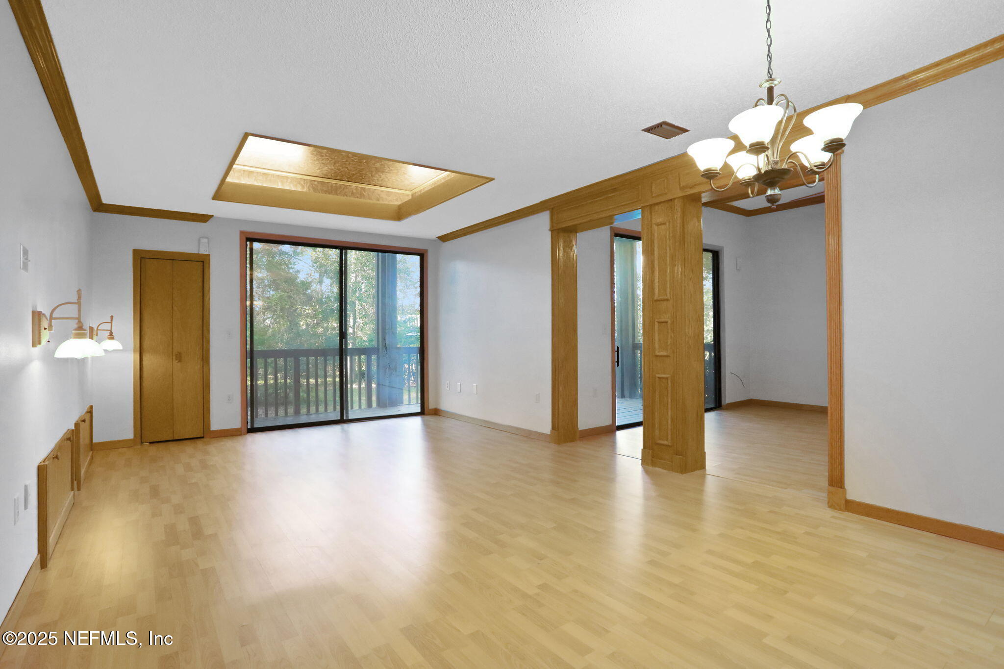 2970 Ravines Road, Unit 1308 Middleburg, FL 32068 - Photo 11 of 33 a view of an empty room with window and wooden floor