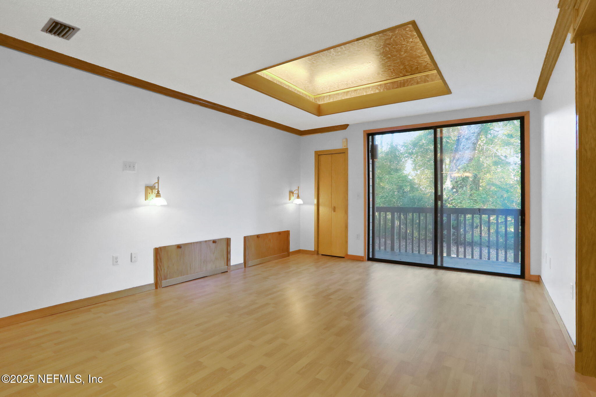 2970 Ravines Road, Unit 1308 Middleburg, FL 32068 - Photo 13 of 33 a view of an empty room with wooden floor and a window
