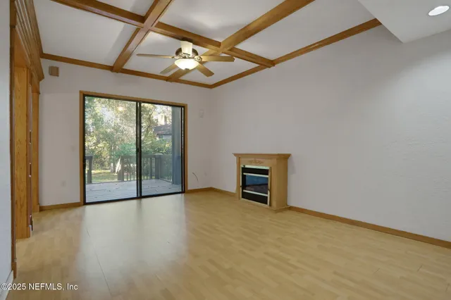a view of a hallway with a chandelier