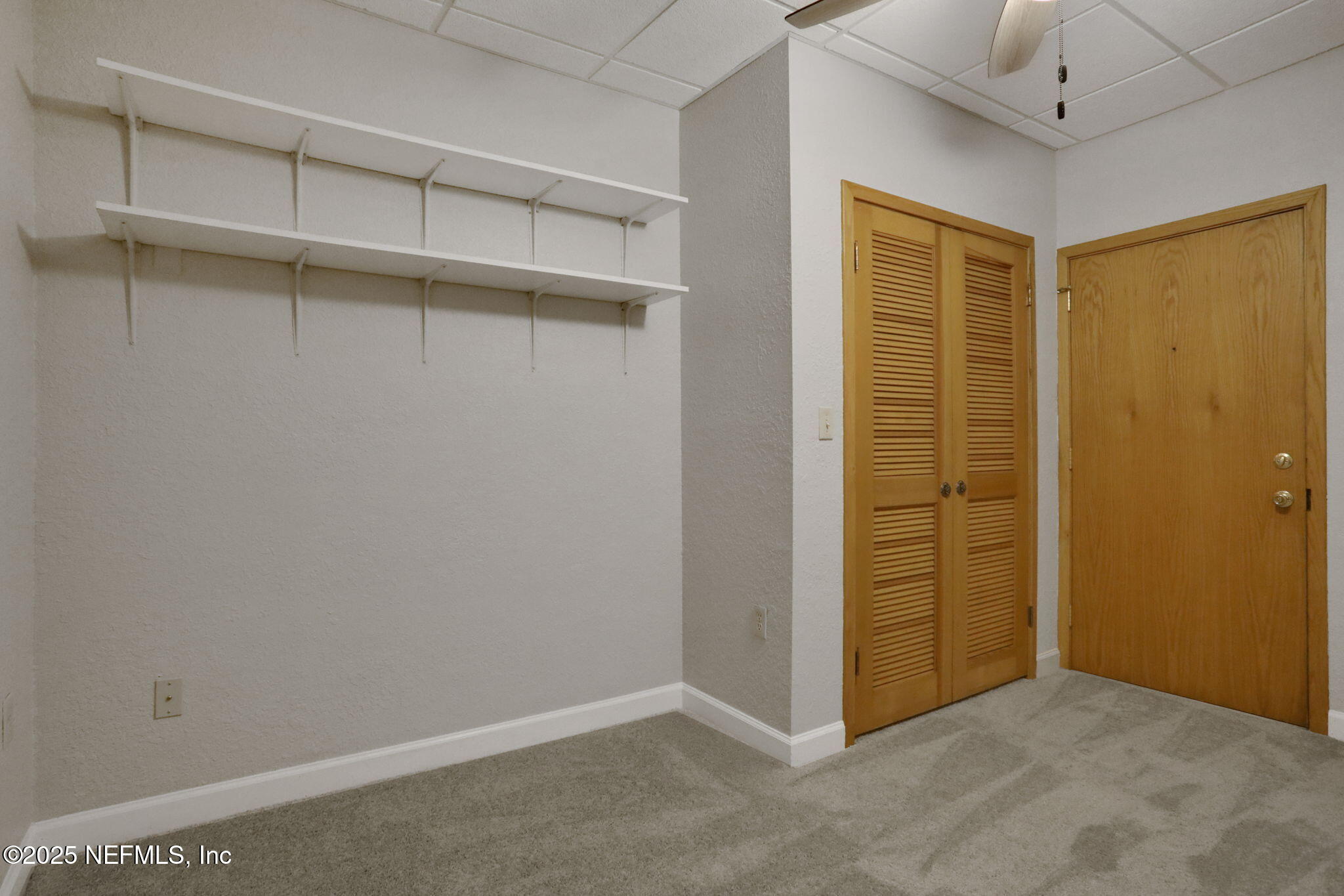 2970 Ravines Road, Unit 1308 Middleburg, FL 32068 - Photo 18 of 33 an empty room with walk in closet
