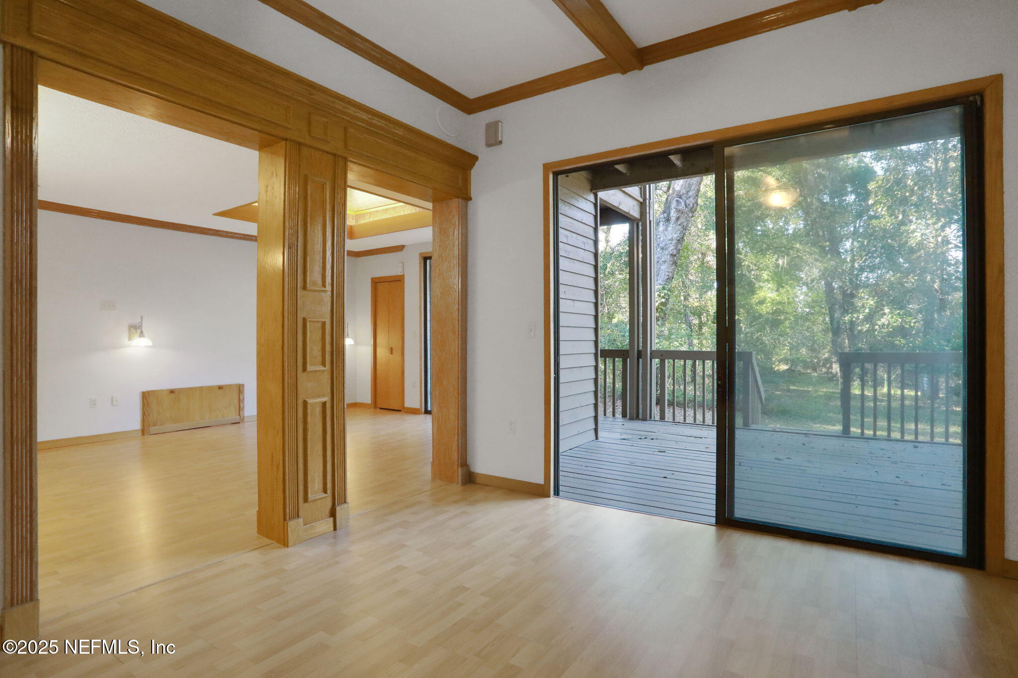 2970 Ravines Road, Unit 1308 Middleburg, FL 32068 - Photo 21 of 33 a view of a hallway with wooden floor and glass door