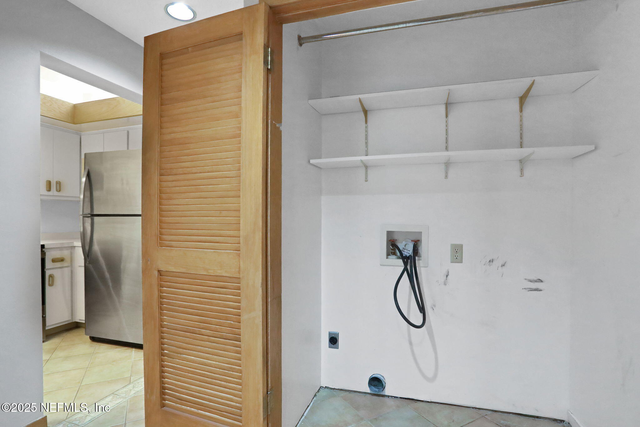 2970 Ravines Road, Unit 1308 Middleburg, FL 32068 - Photo 28 of 33 a bathroom with a glass shower door