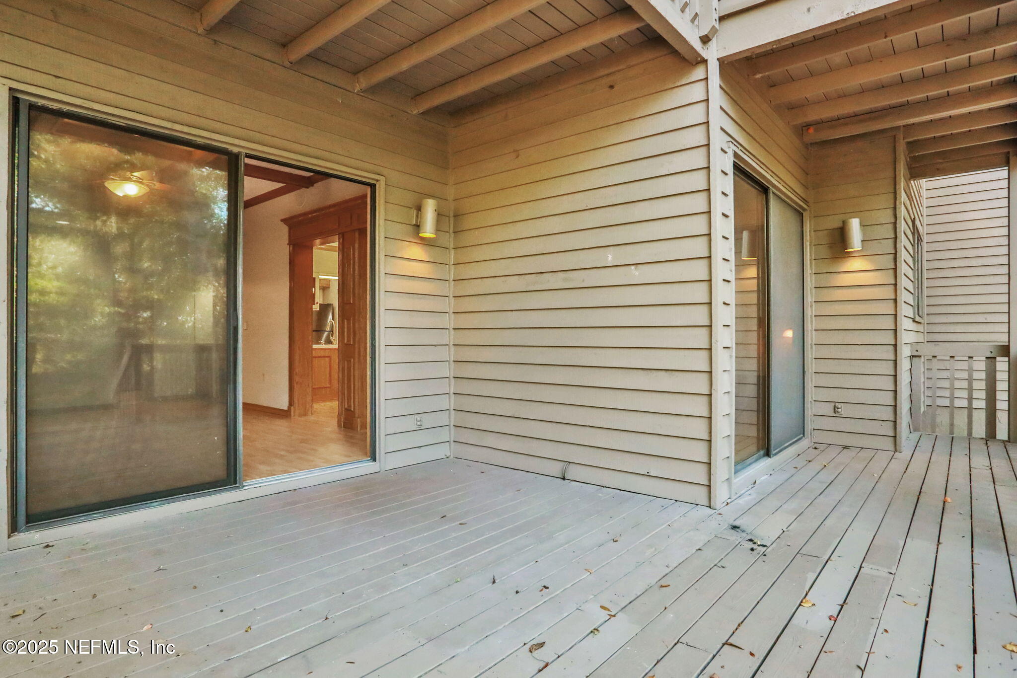 2970 Ravines Road, Unit 1308 Middleburg, FL 32068 - Photo 31 of 33 a view of a porch with wooden floor and a entrance