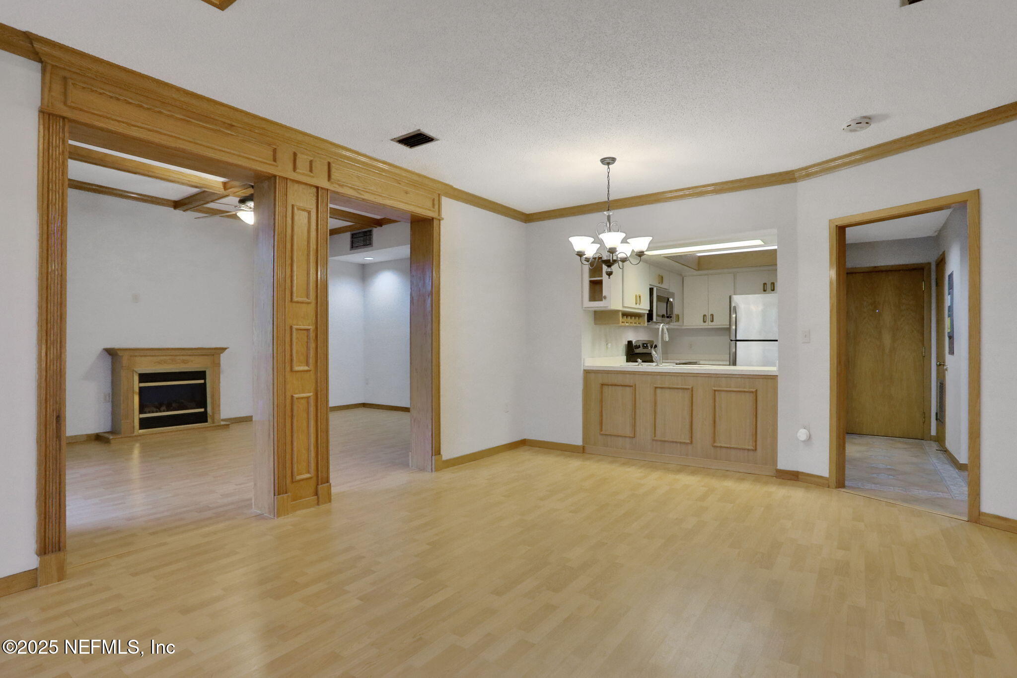 2970 Ravines Road, Unit 1308 Middleburg, FL 32068 - Photo 8 of 33 a view of a kitchen with a sink and a fireplace
