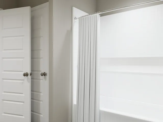 a bedroom with bed and a window