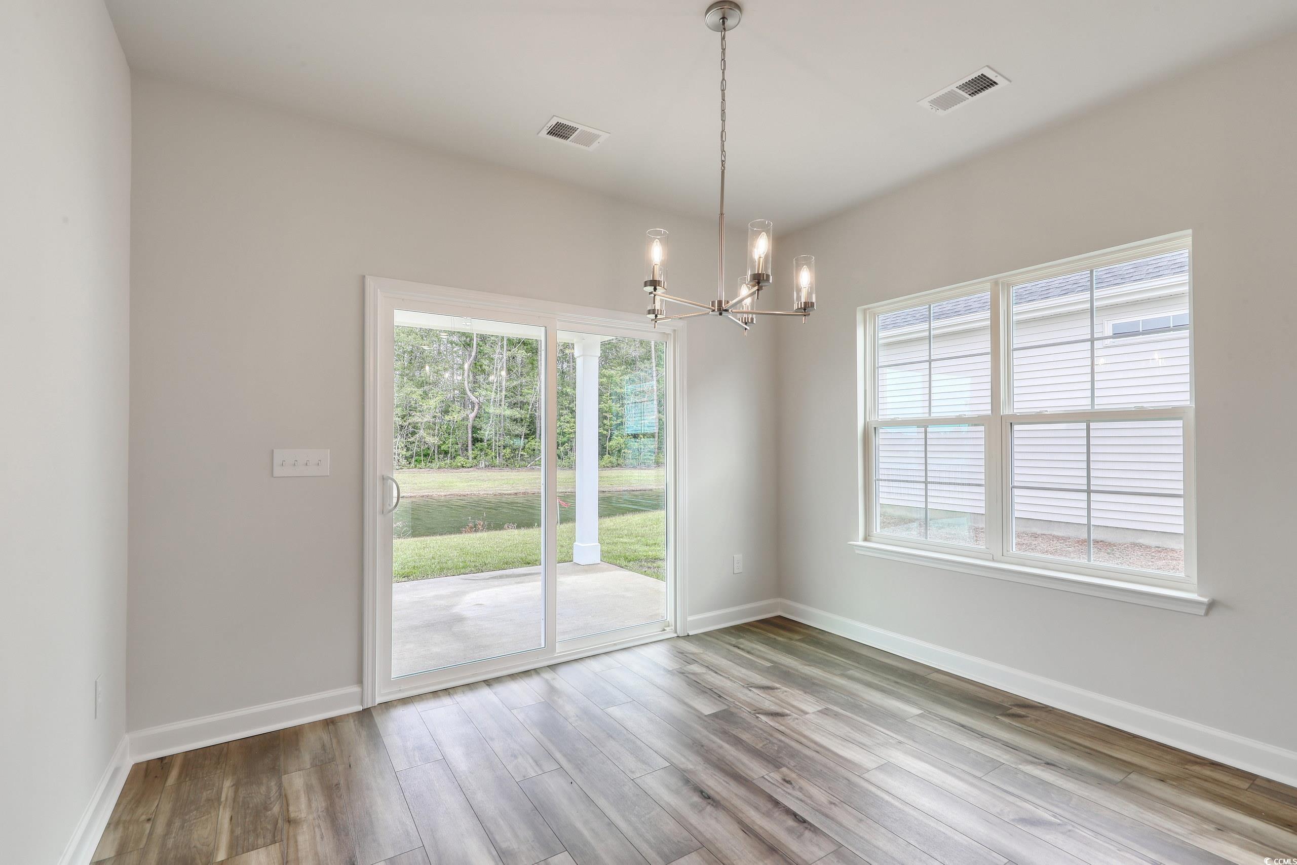 160 Azure Loop Myrtle Beach, SC 29588 - Photo 11 of 36 Unfurnished room featuring wood-type flooring and
