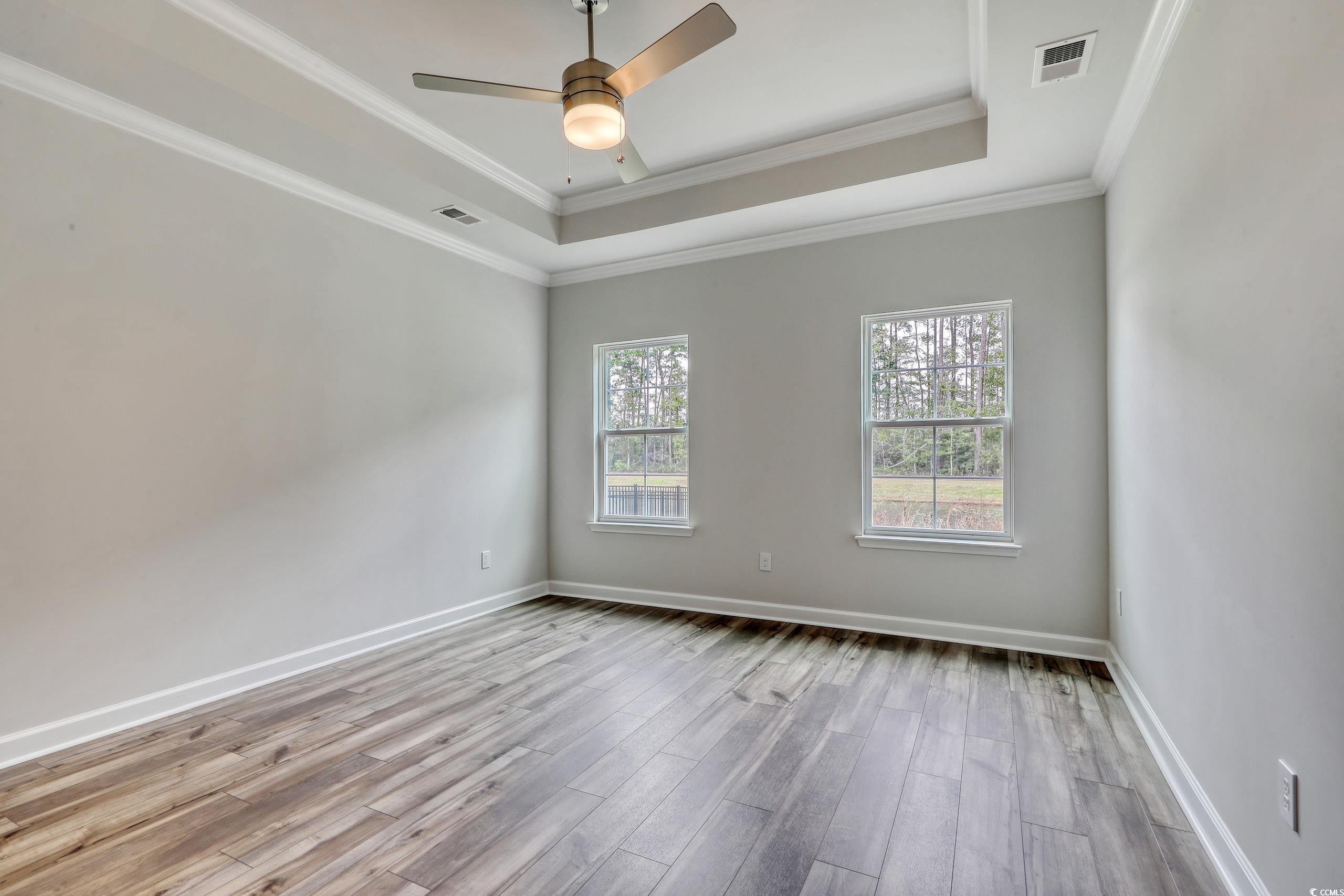 160 Azure Loop Myrtle Beach, SC 29588 - Photo 15 of 36 Spare room with ceiling fan, ornamental molding, a