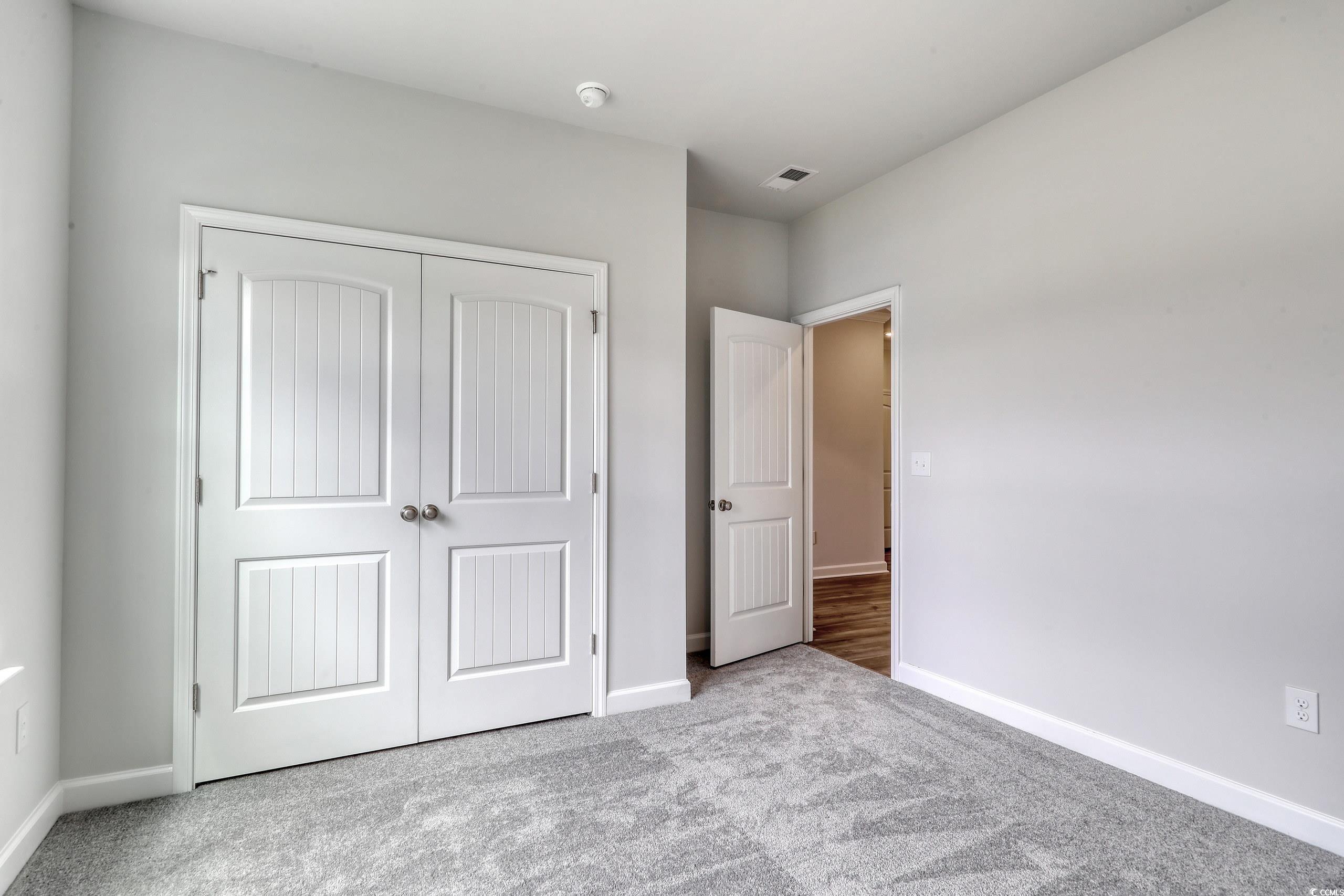 160 Azure Loop Myrtle Beach, SC 29588 - Photo 5 of 36 Unfurnished bedroom featuring light colored carpet