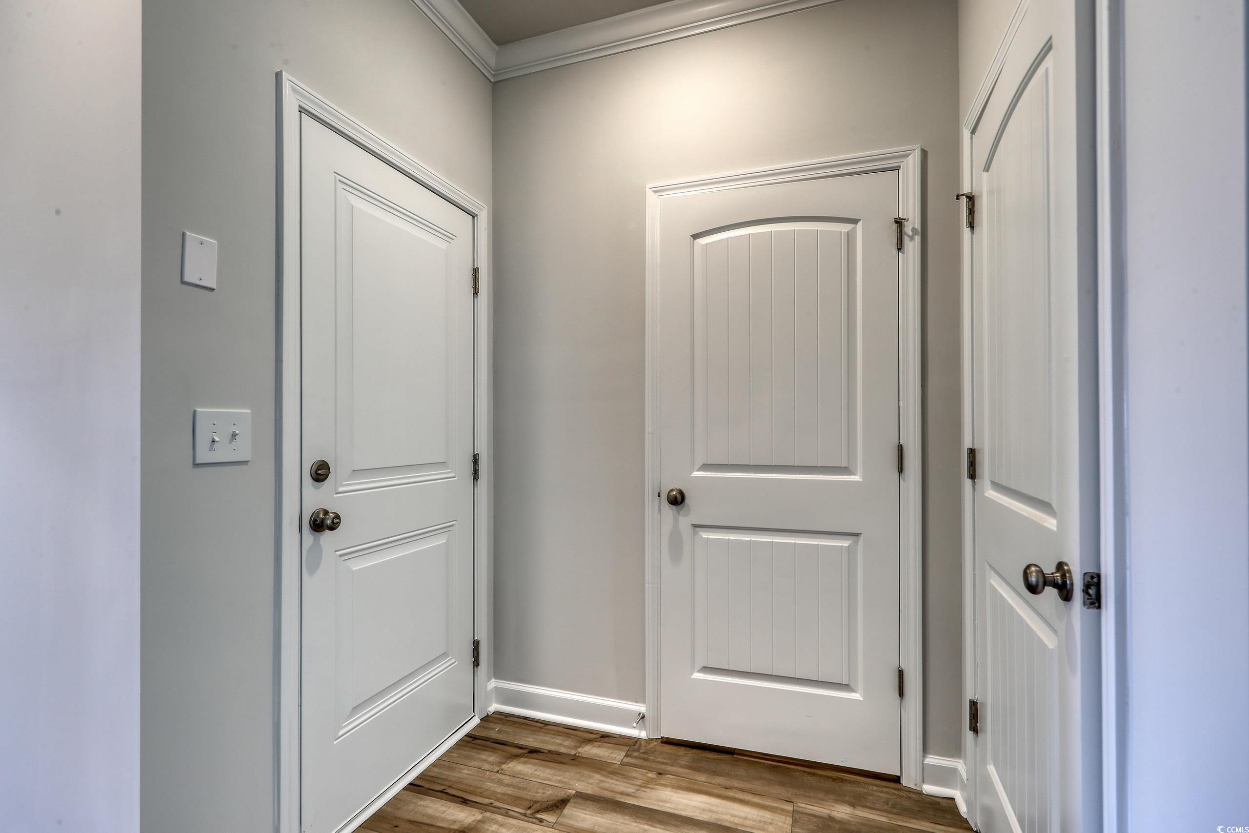 160 Azure Loop Myrtle Beach, SC 29588 - Photo 7 of 36 Doorway to outside with wood-type flooring and cro