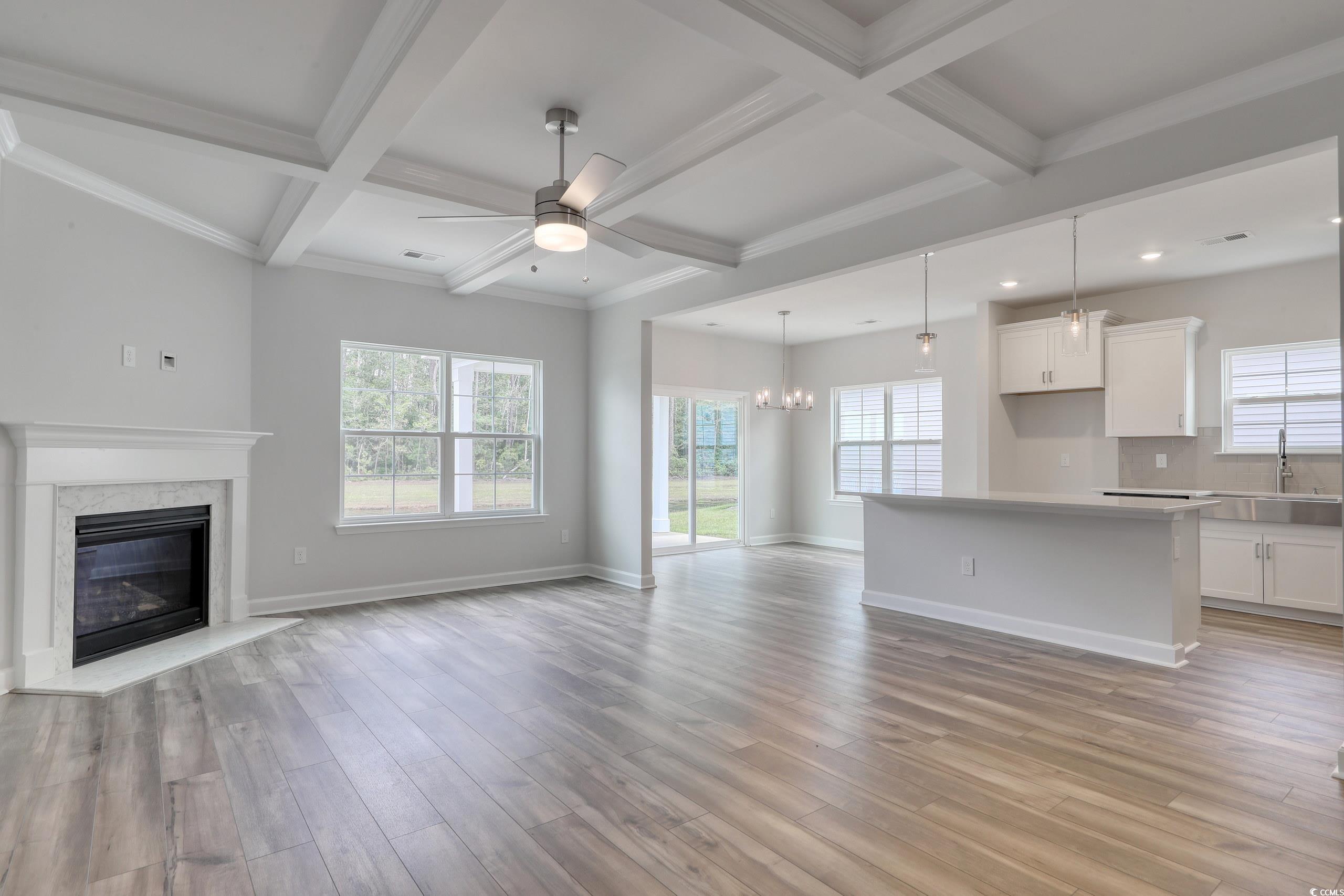 160 Azure Loop Myrtle Beach, SC 29588 - Photo 9 of 36 Unfurnished living room featuring ceiling fan with