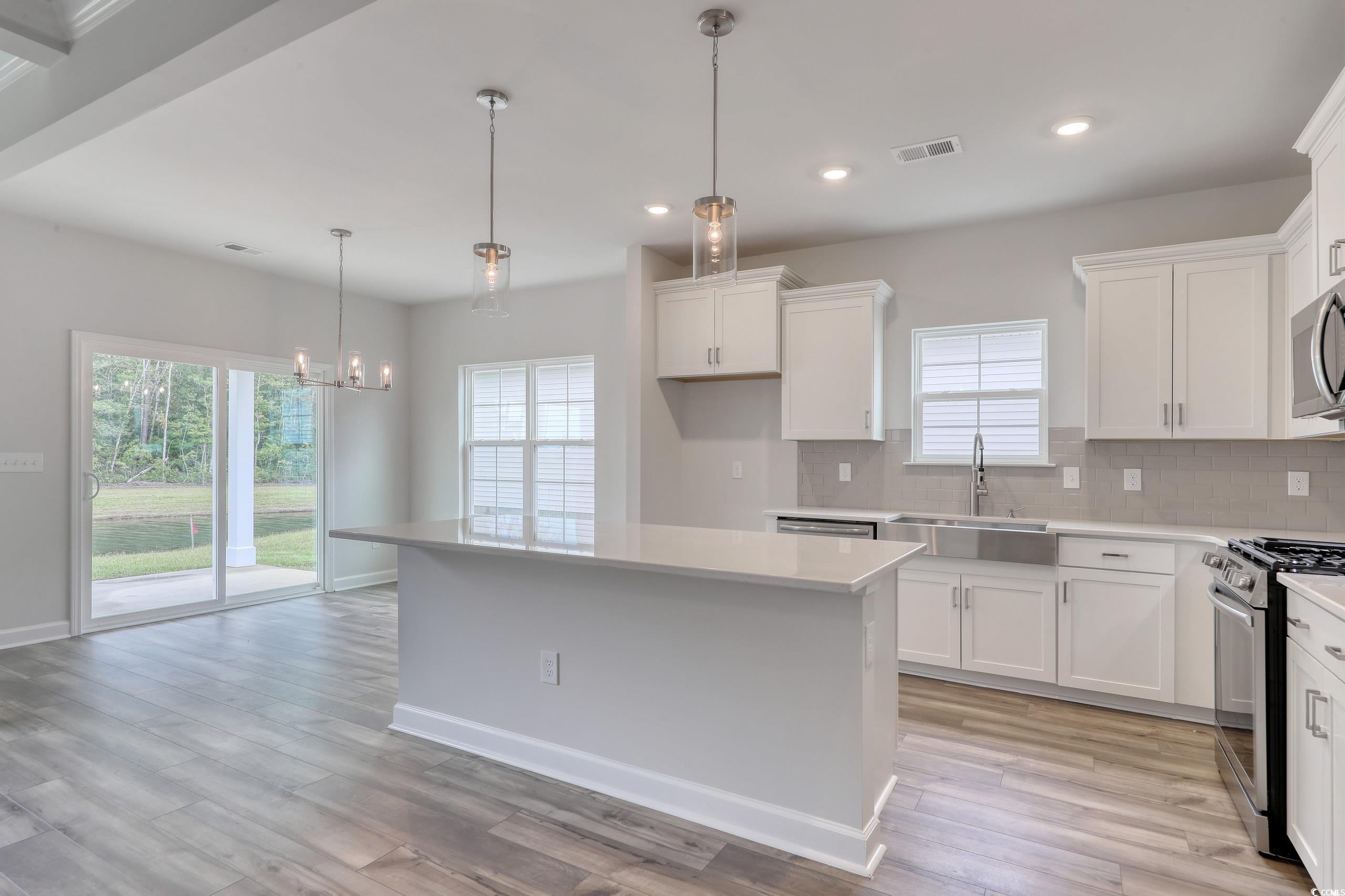 160 Azure Loop Myrtle Beach, SC 29588 - Photo 10 of 36 Kitchen featuring a wealth of natural light, a cen