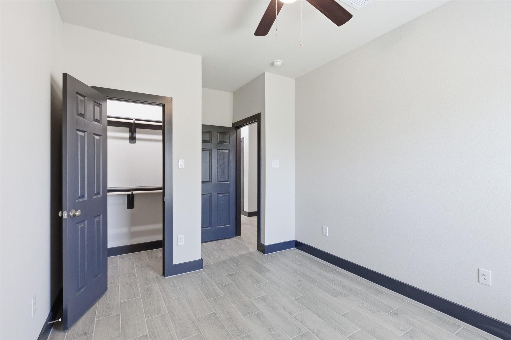 9412 Crofton Street, Unit B Houston, TX 77016 - Photo 11 of 20 an empty room with closet and windows
